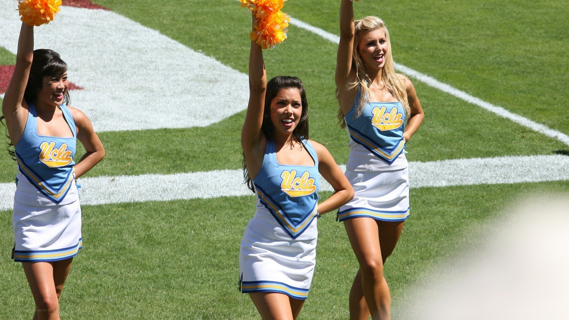 UCLA cheerleaders on field