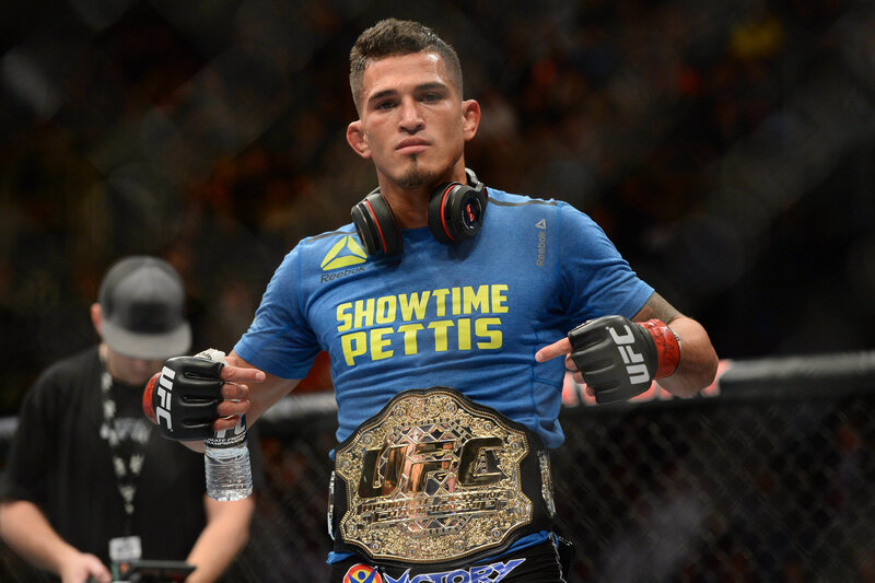 UFC fighter with championship belt