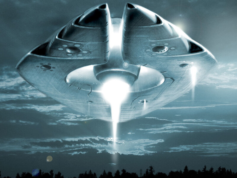 UFO hovering over landscape