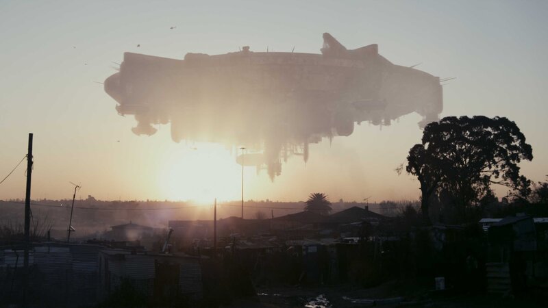 UFO over a township at sunset