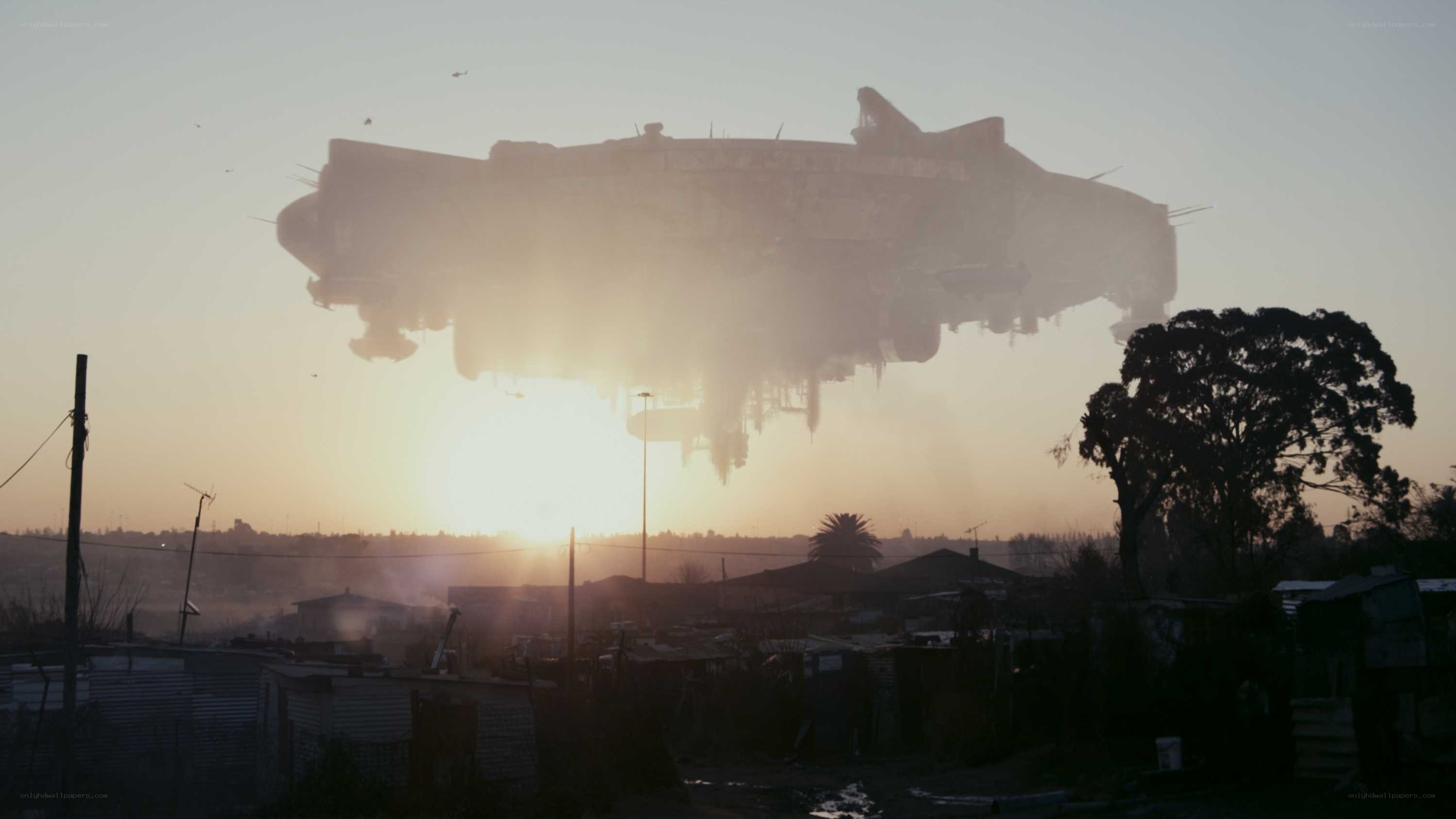 UFO over a township at sunset