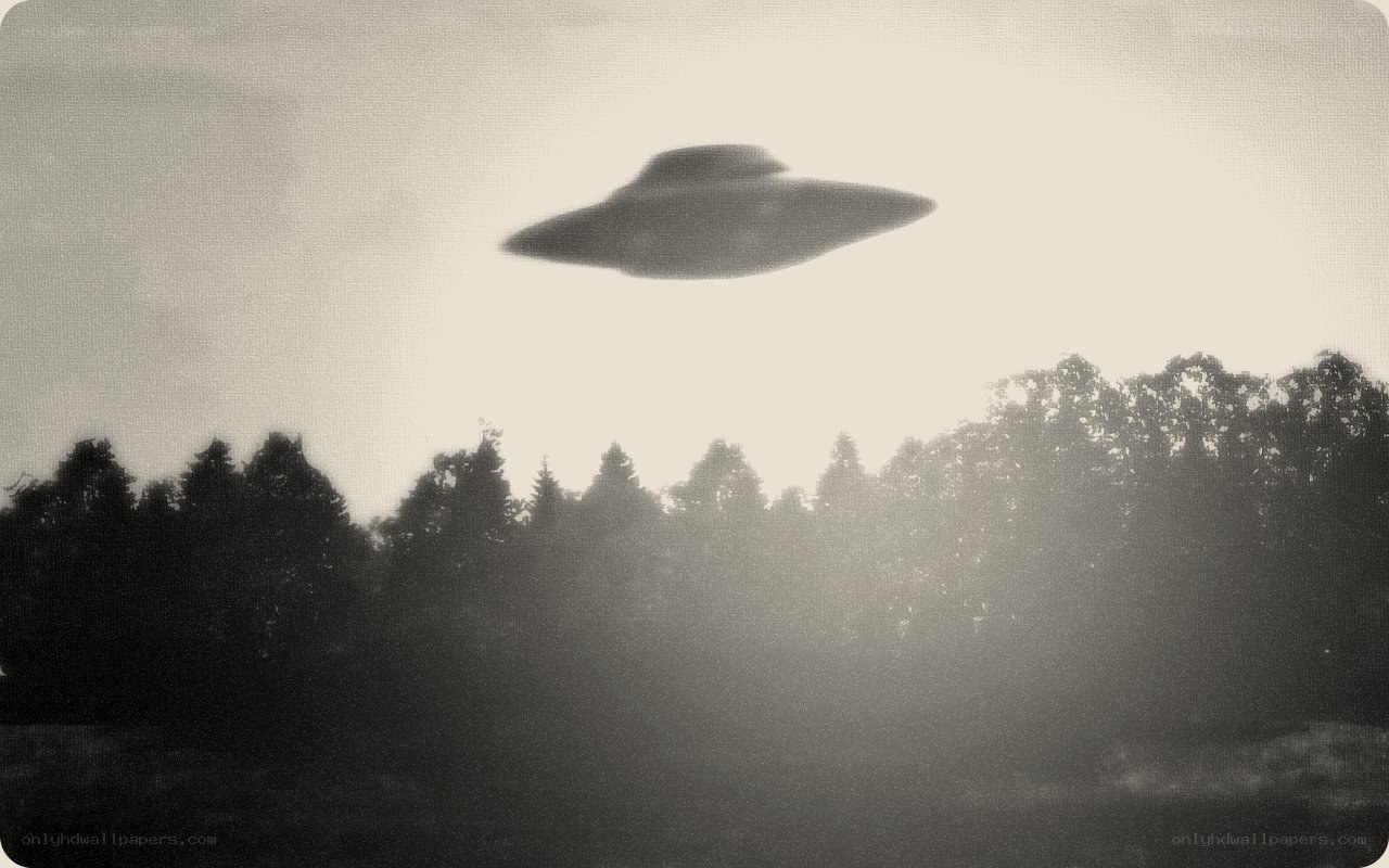 UFO over forest silhouette