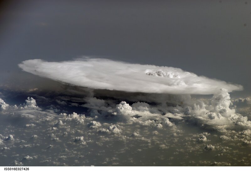 UFO-shaped cloud over clouds