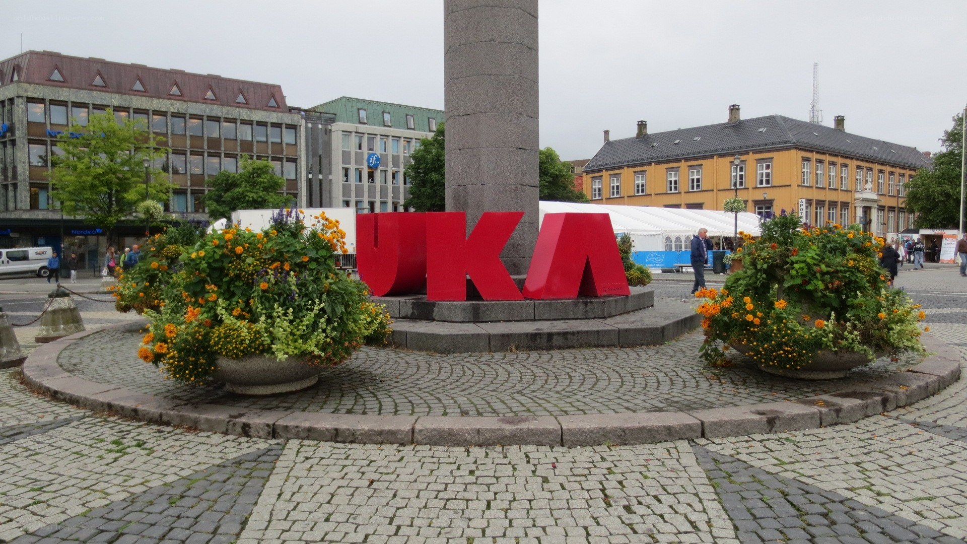 UKA sign in a city square