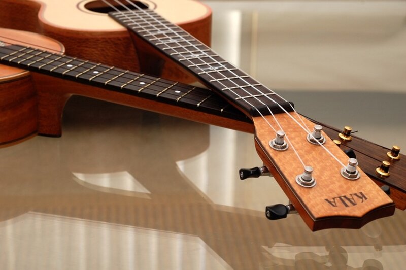Ukuleles on Glass Surface