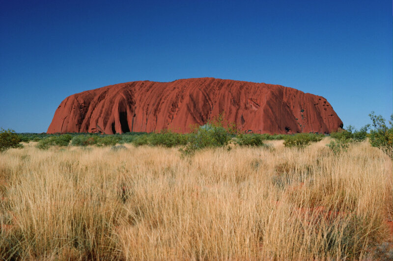 Uluru Rock Formation — Red, Serene, Afternoon, Photograph, Grass, Bushes