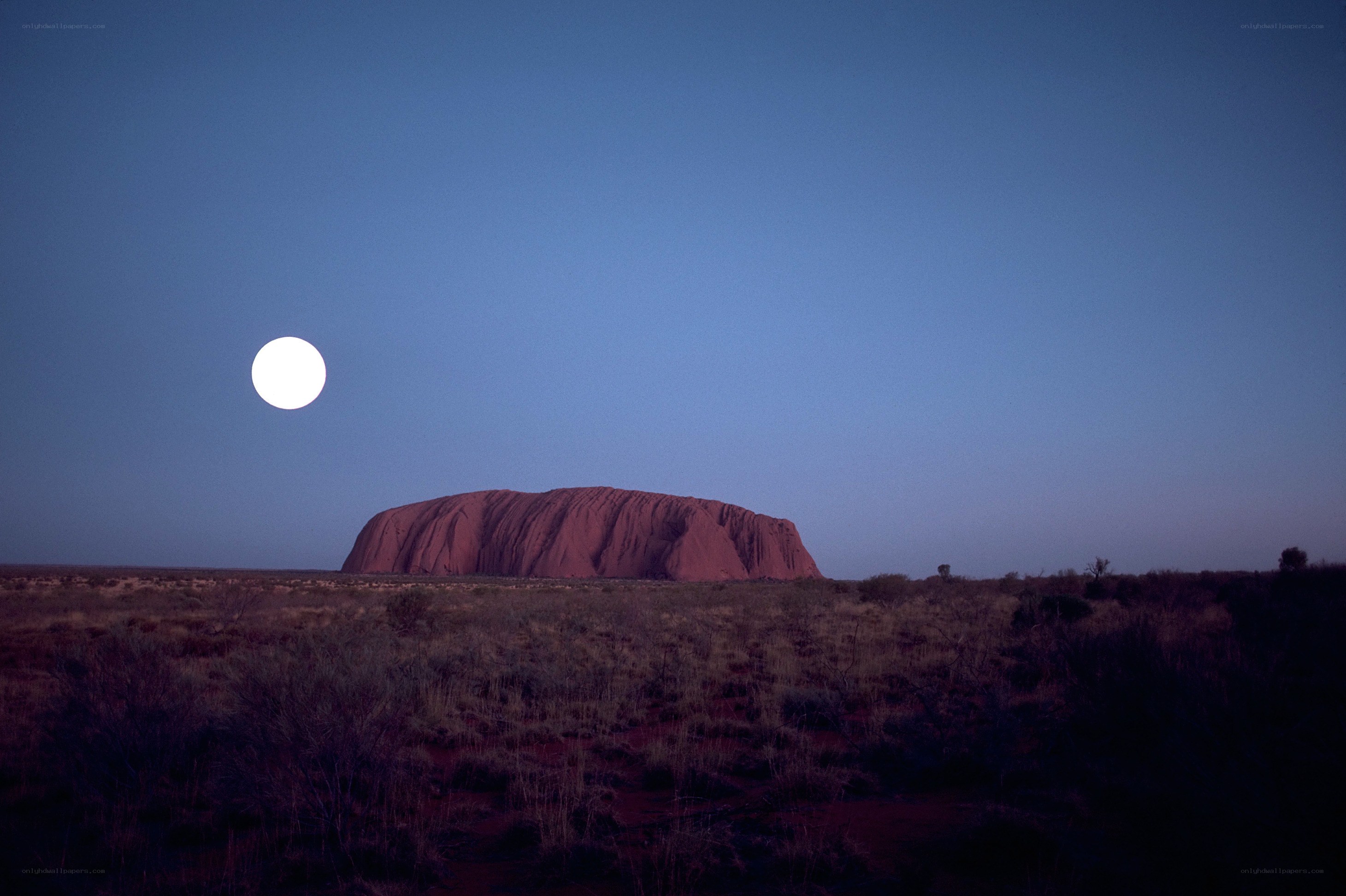 Uluru under a full moon