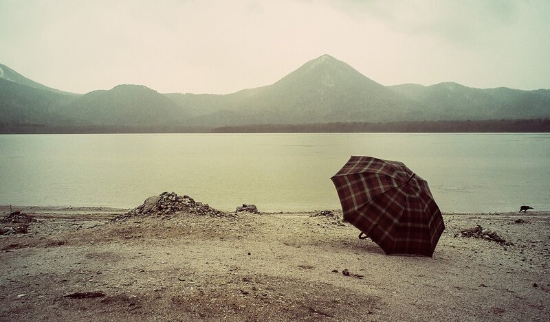 umbrella on a lakeshore