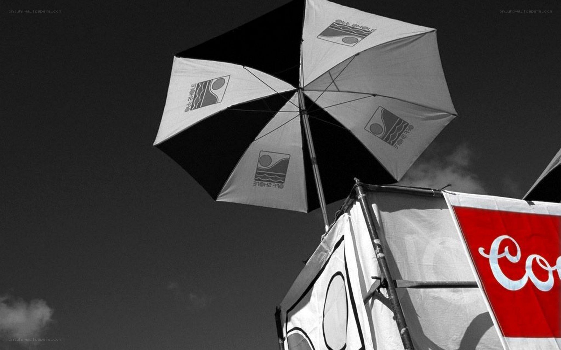 umbrella with logo against sky