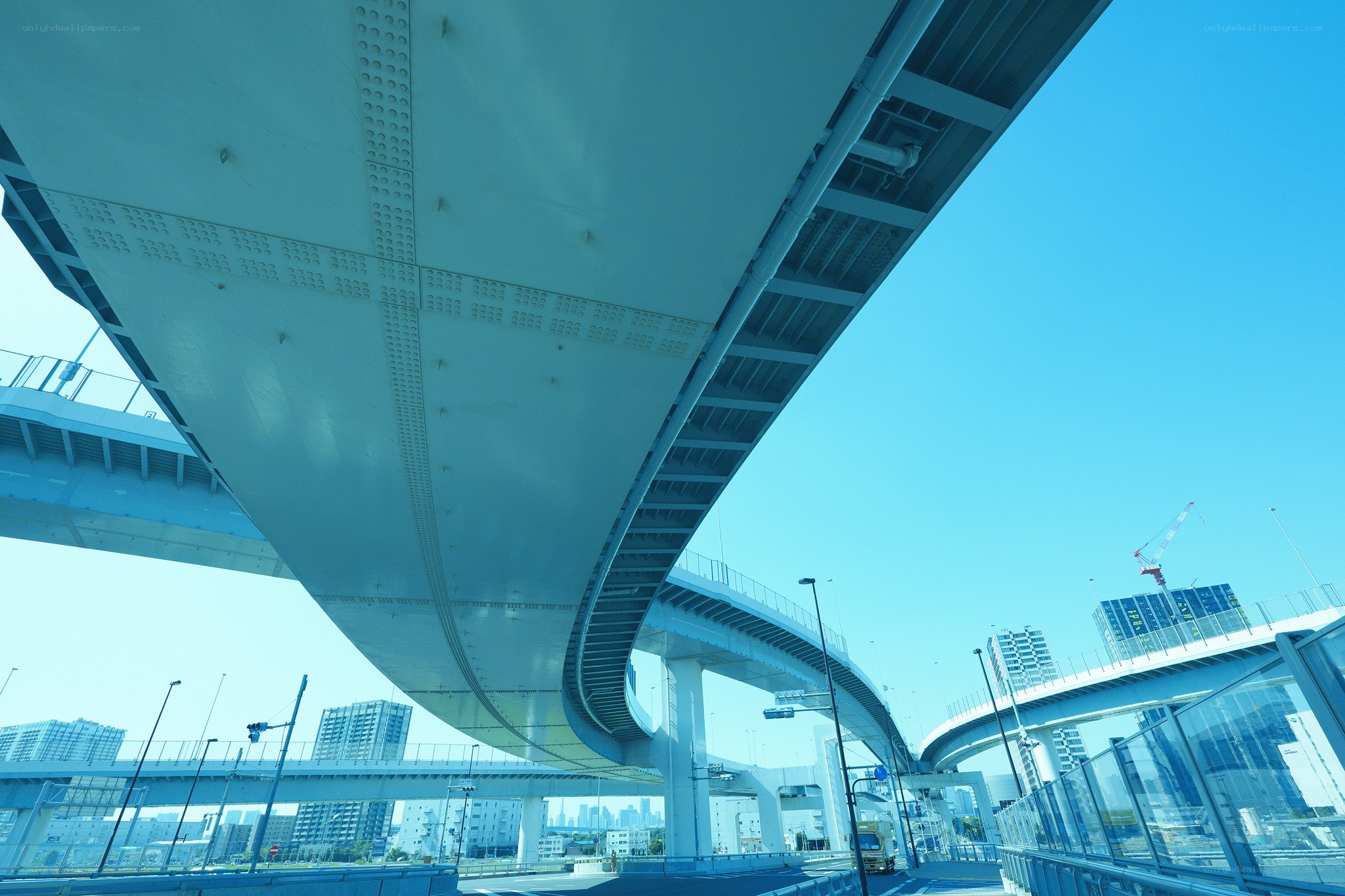 Under a curved highway overpass