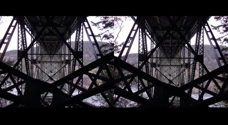 underneath a steel truss bridge