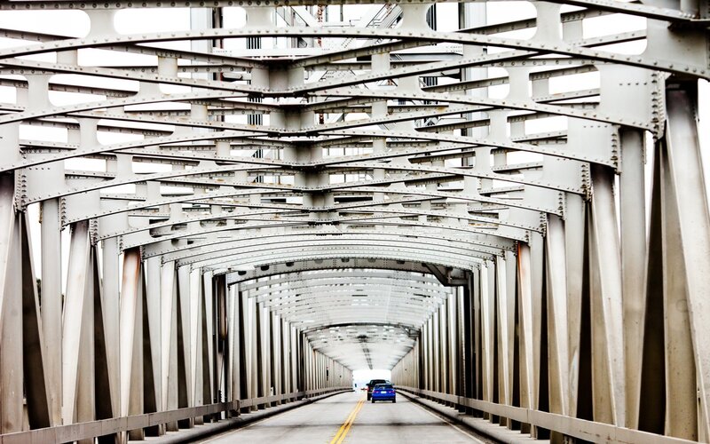 Underneath a steel truss bridge