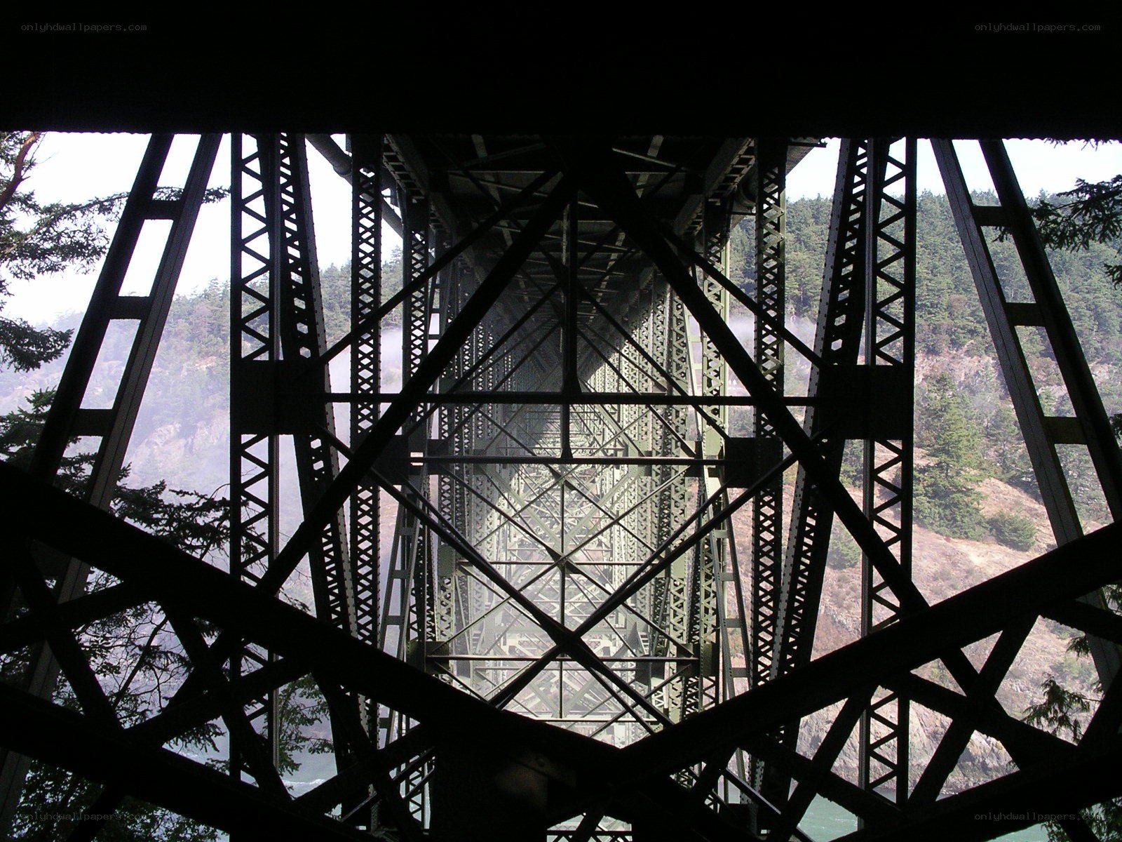 Underneath a steel truss bridge