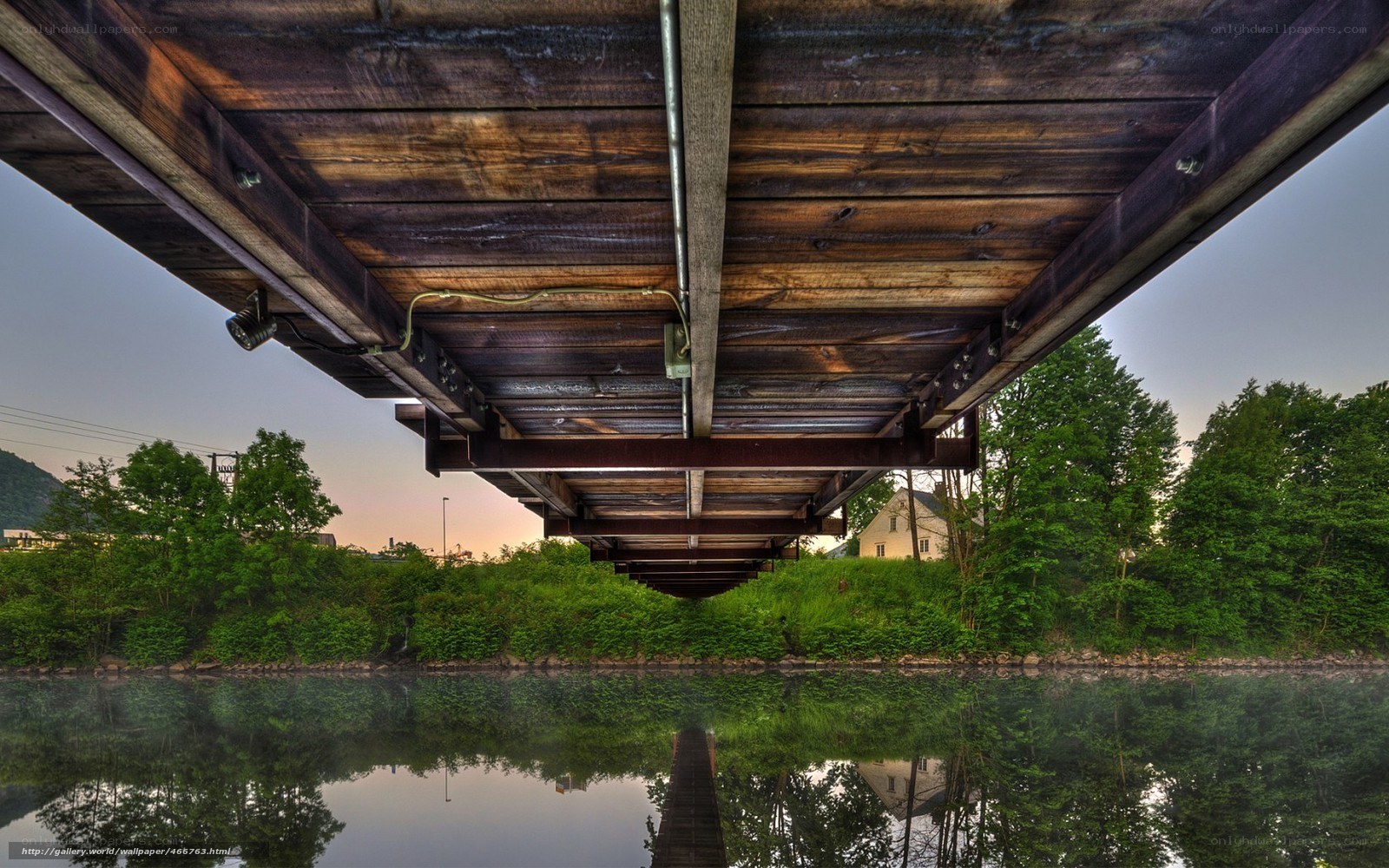 Underneath a wooden bridge