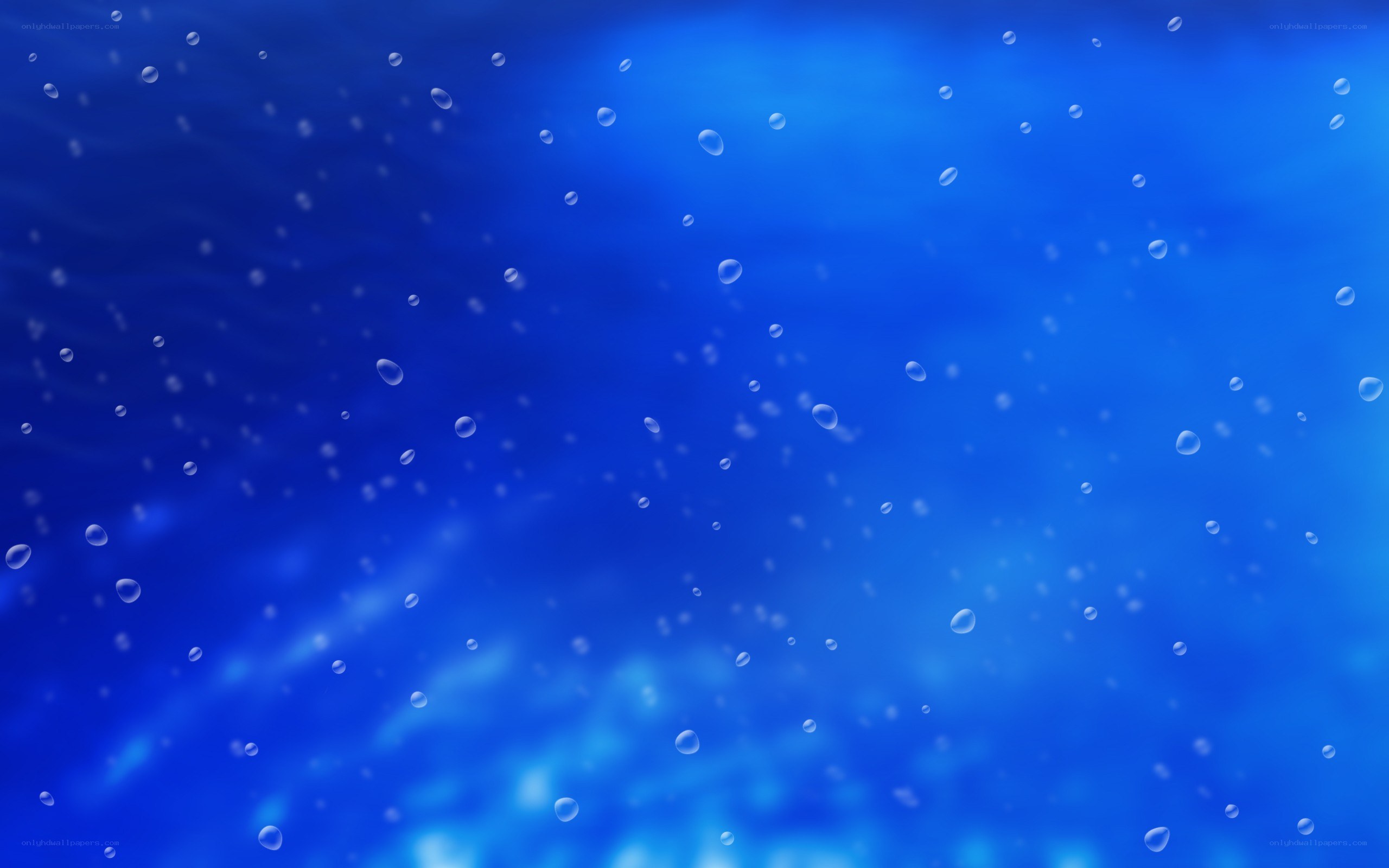 underwater bubbles in blue water