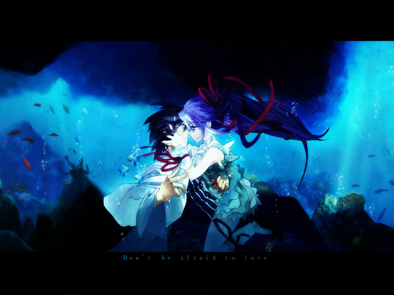 underwater couple embrace