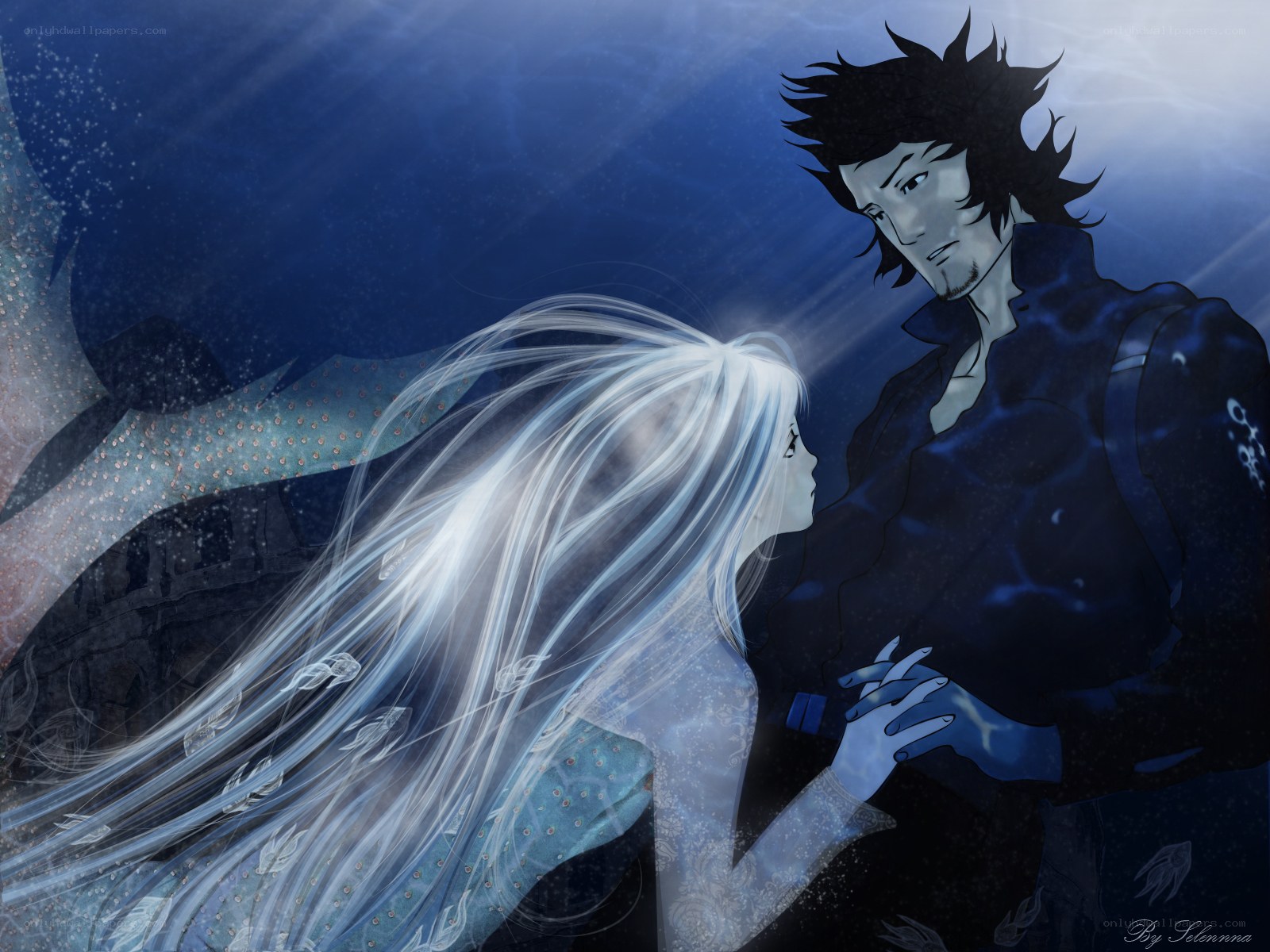 underwater couple embrace