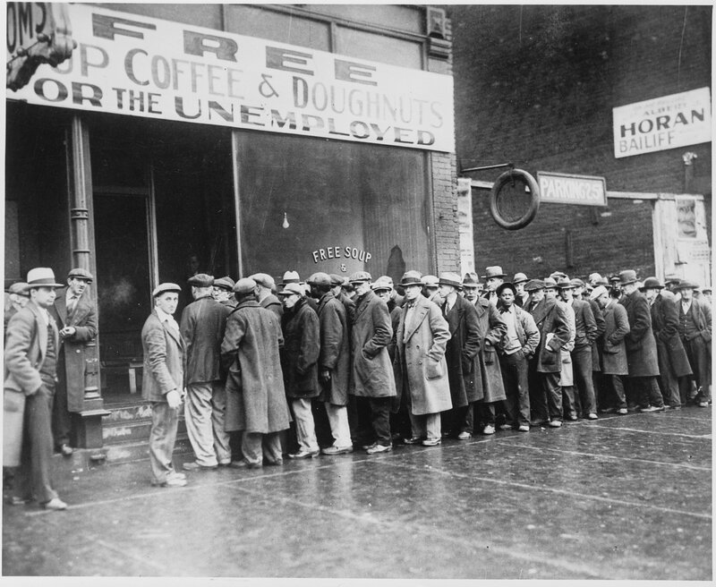 Unemployed men line up for free food