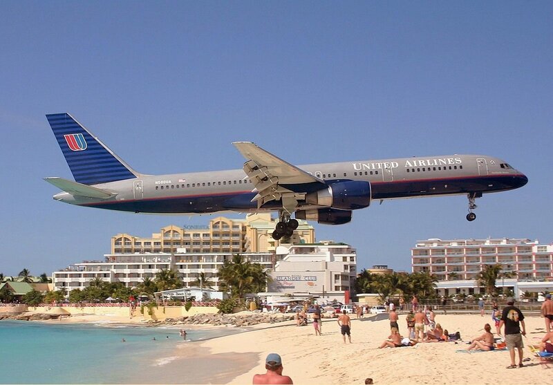 United Airlines plane over beach