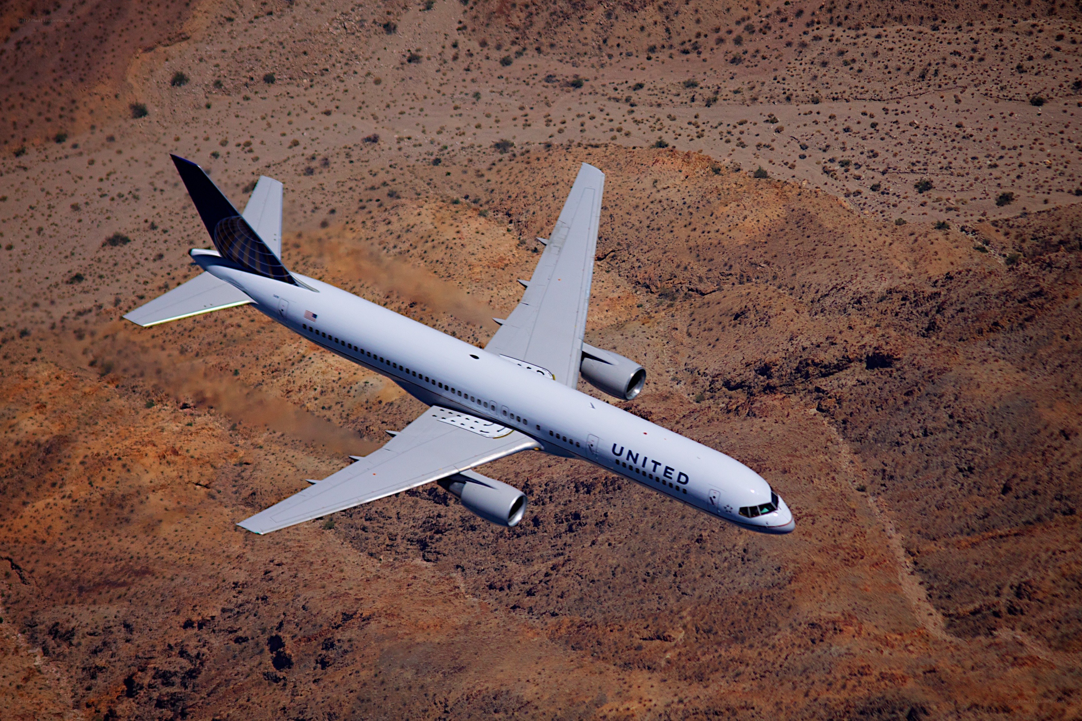United Airlines plane over desert
