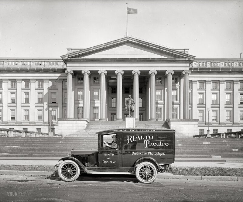 Universal truck in front of a government building