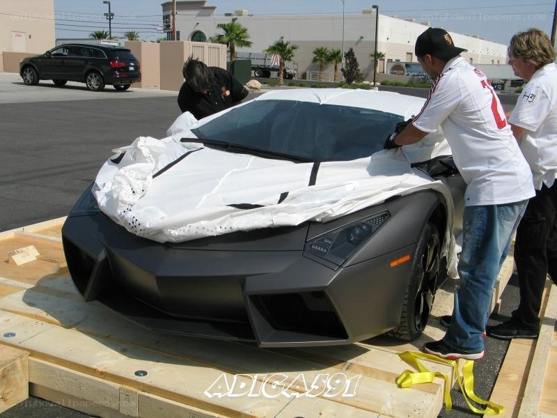 Unwrapping a Lamborghini on a pallet