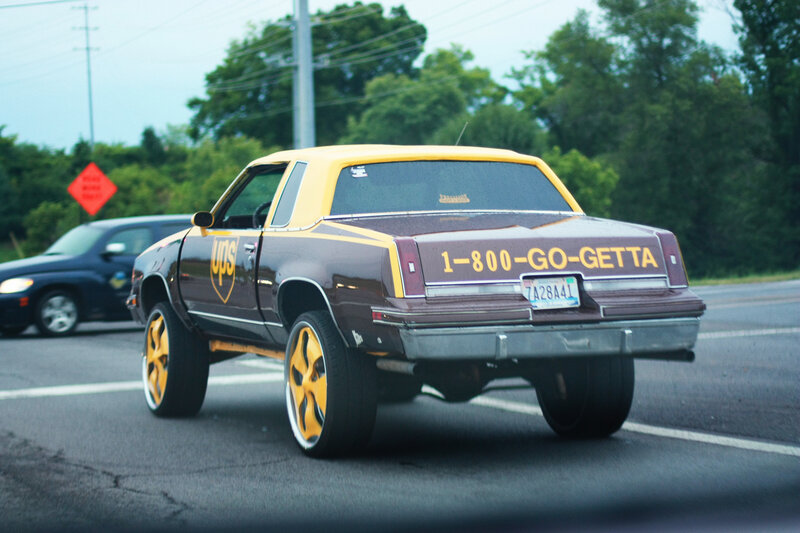 UPS-themed car on road