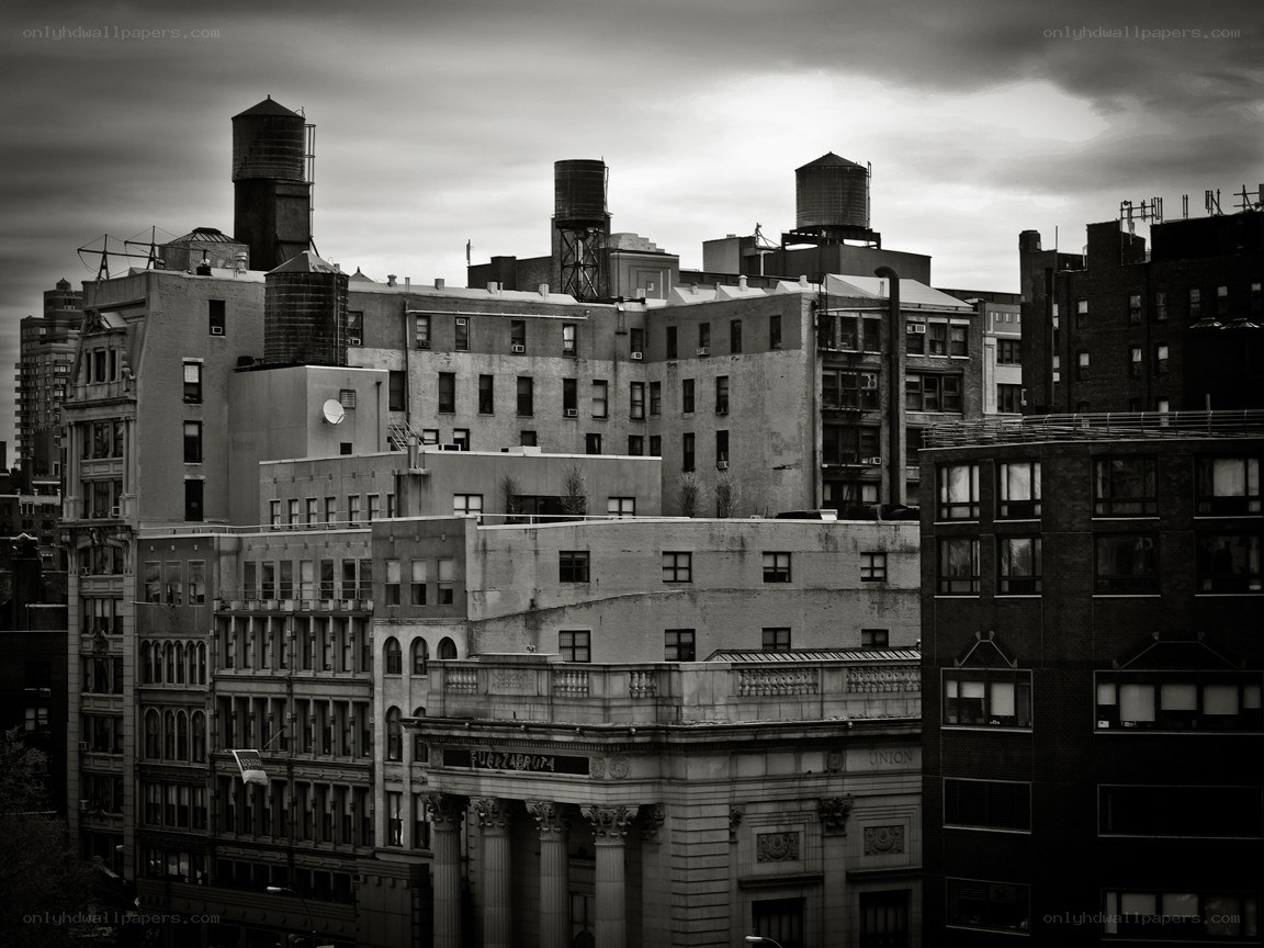 urban rooftops under cloudy sky