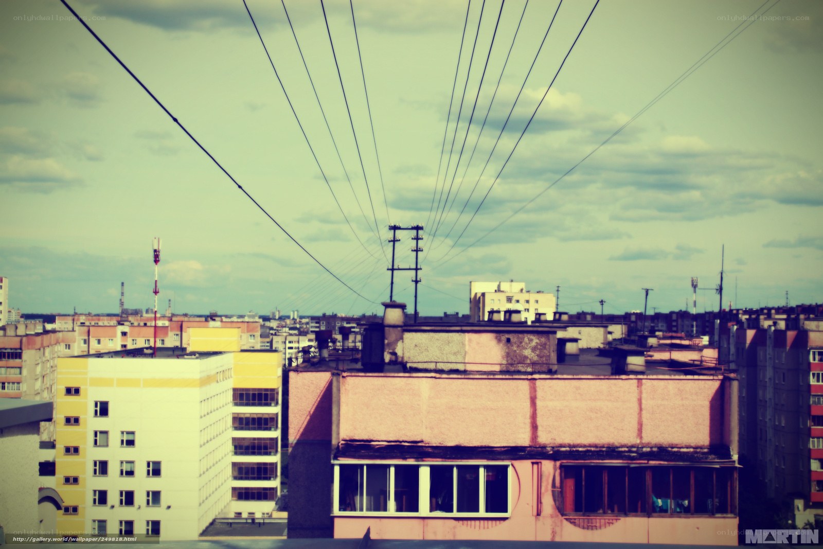 Urban rooftops with power lines