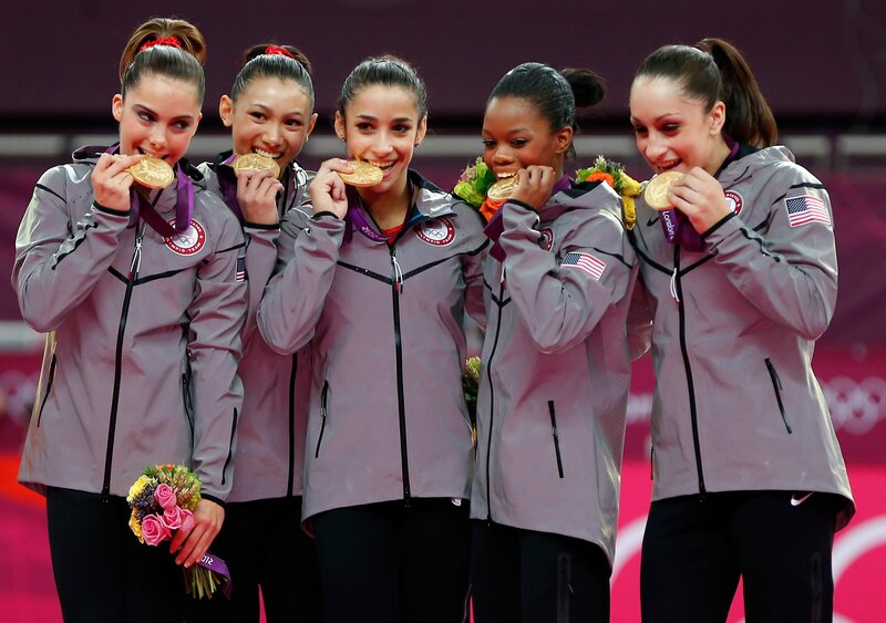 USA gymnastics team with gold medals