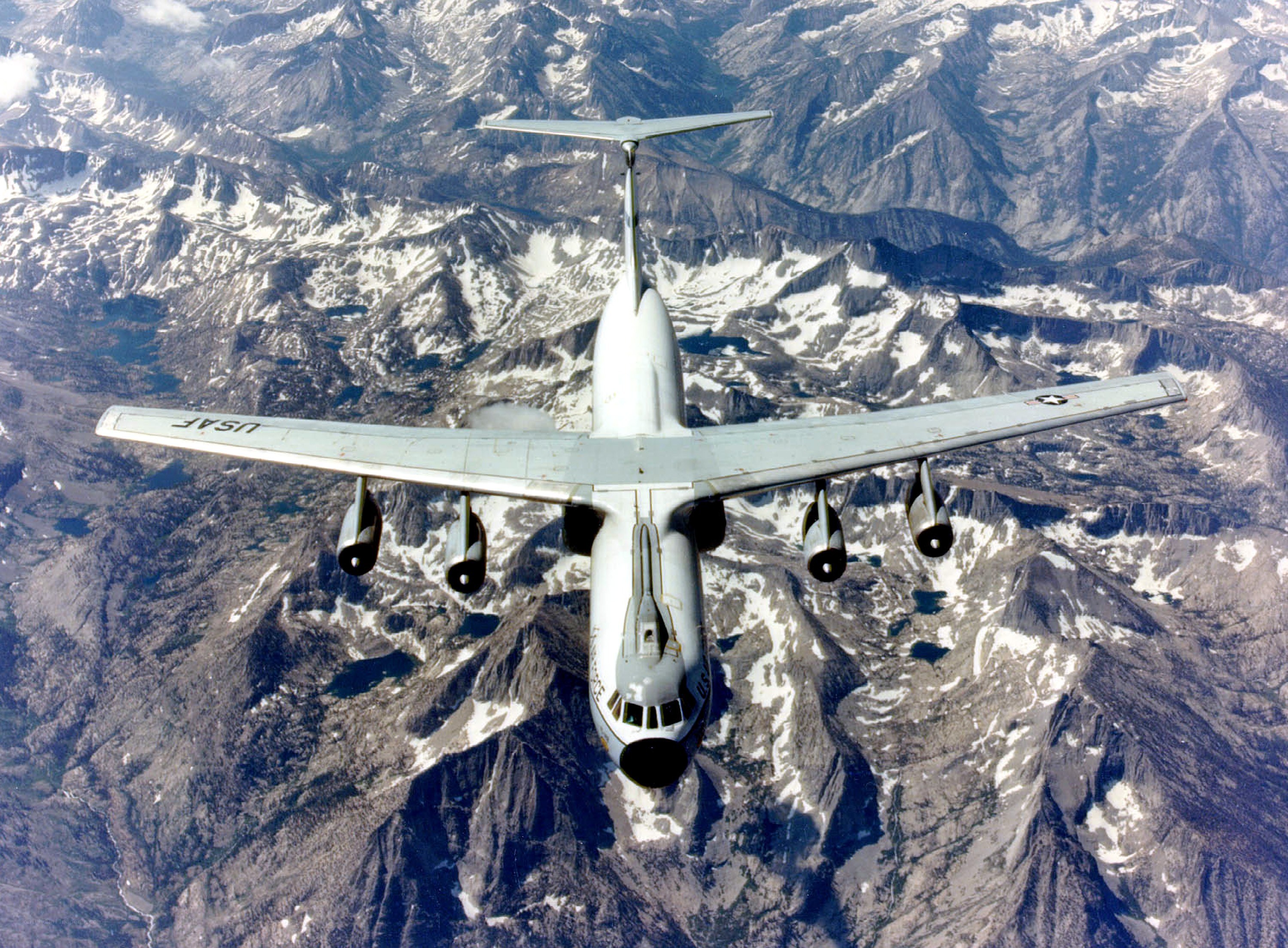 USAF aircraft over snowy mountains