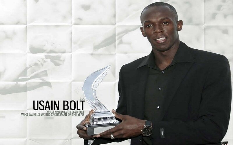 Usain Bolt Holding Trophy