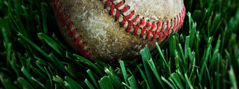 used baseball on grass