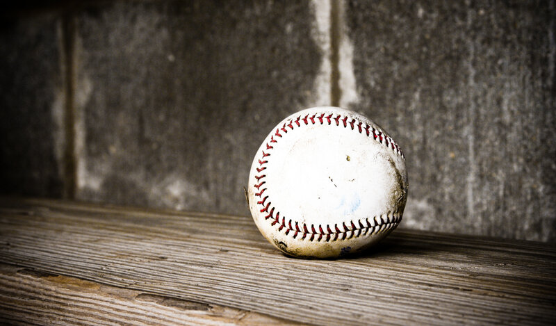used baseball on wooden surface