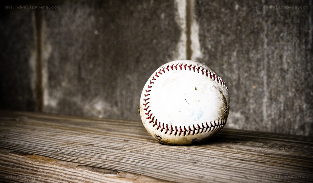 used baseball on wooden surface