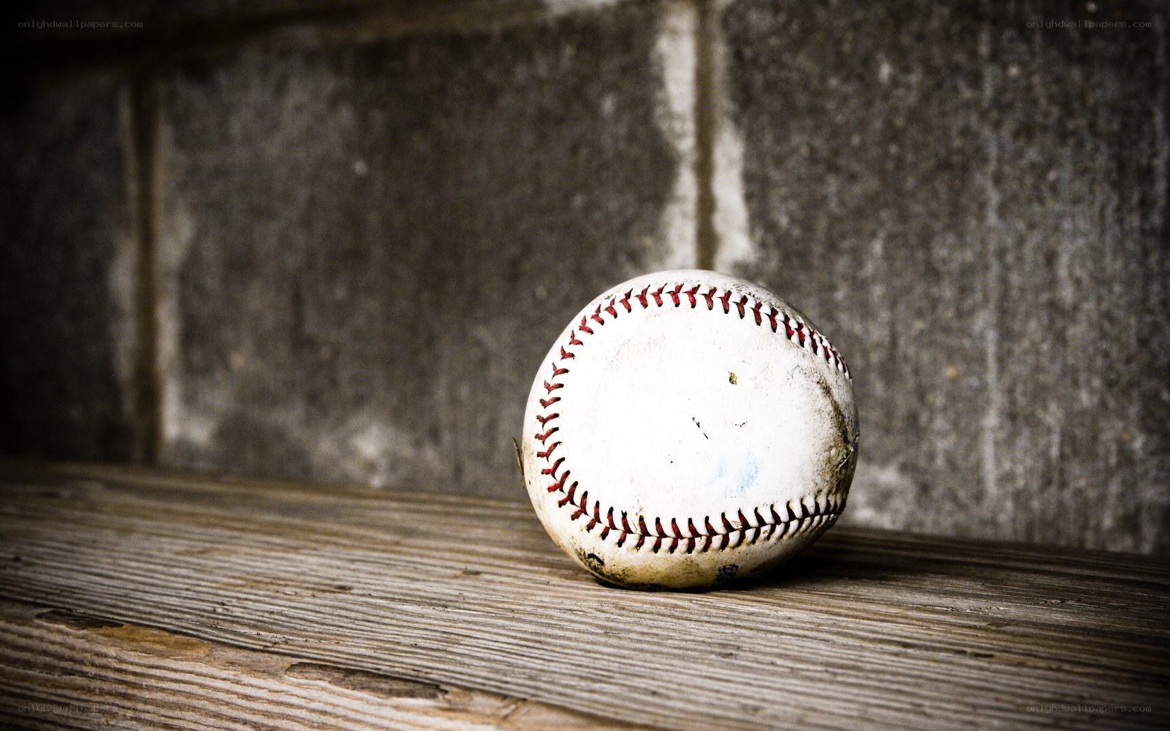 used baseball on wooden surface