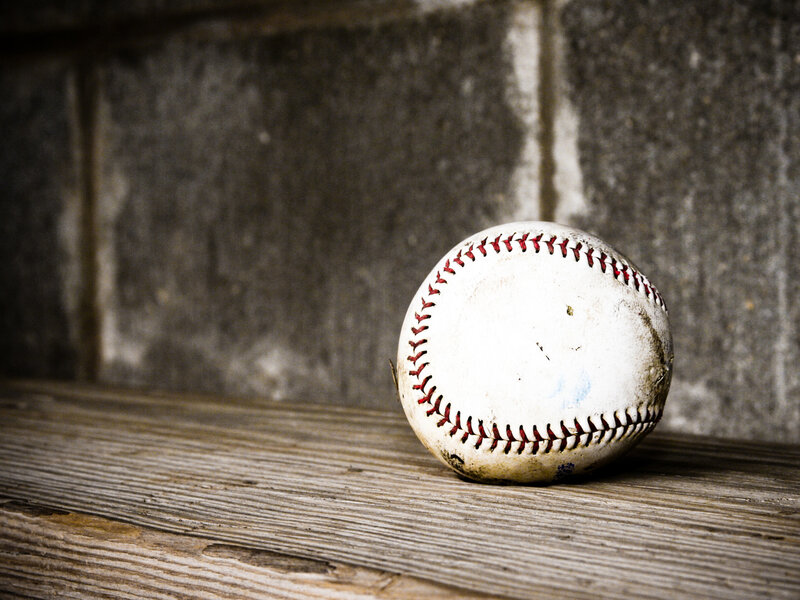 used baseball on wooden surface