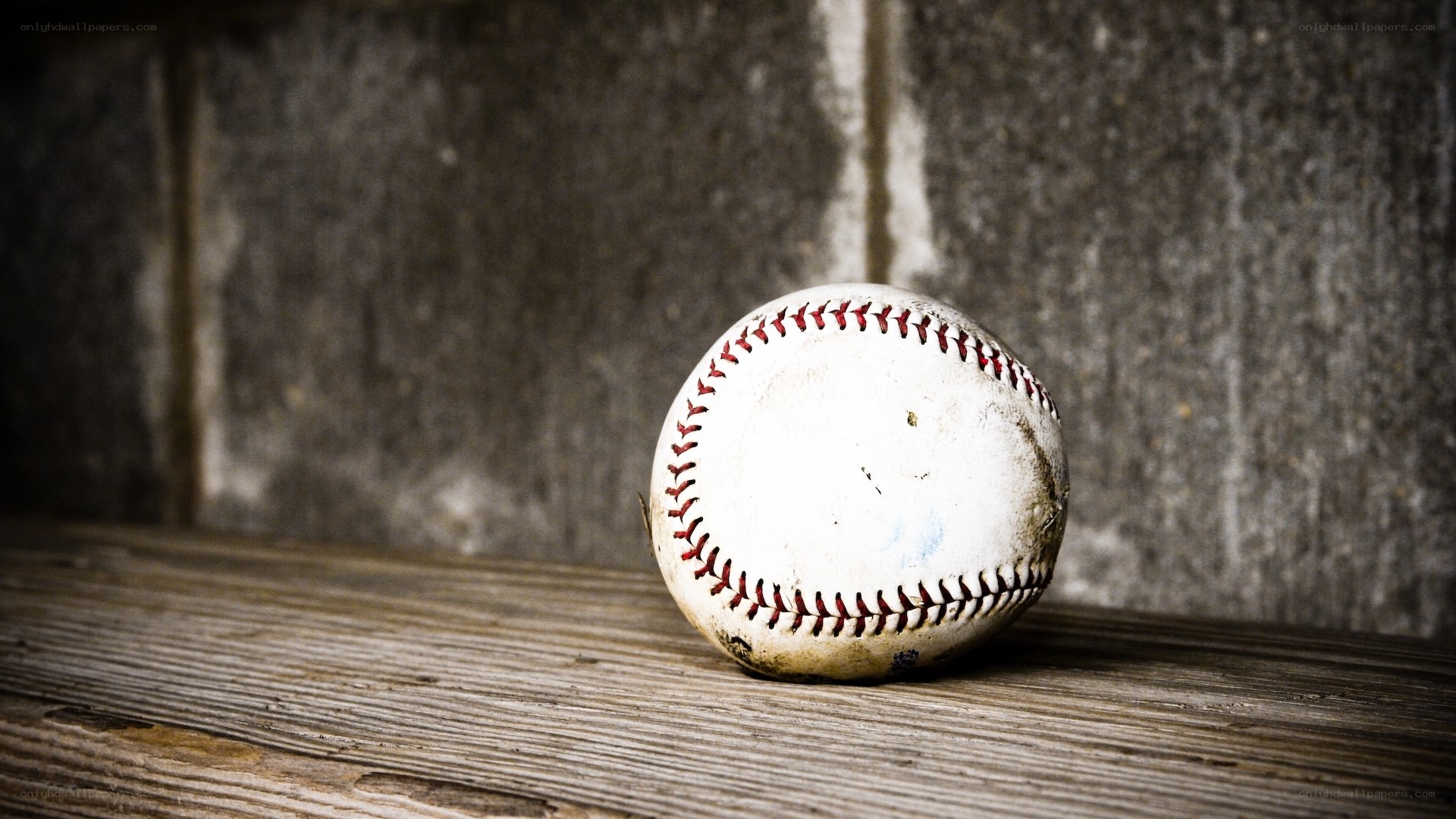 used baseball on wooden surface