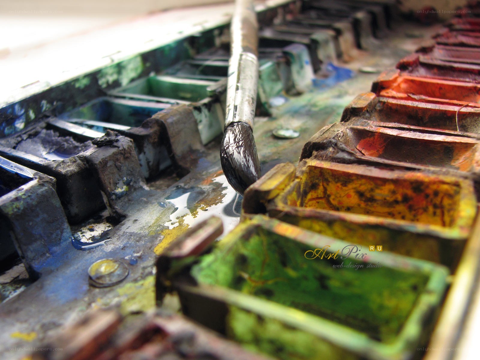 used paint palette with brush