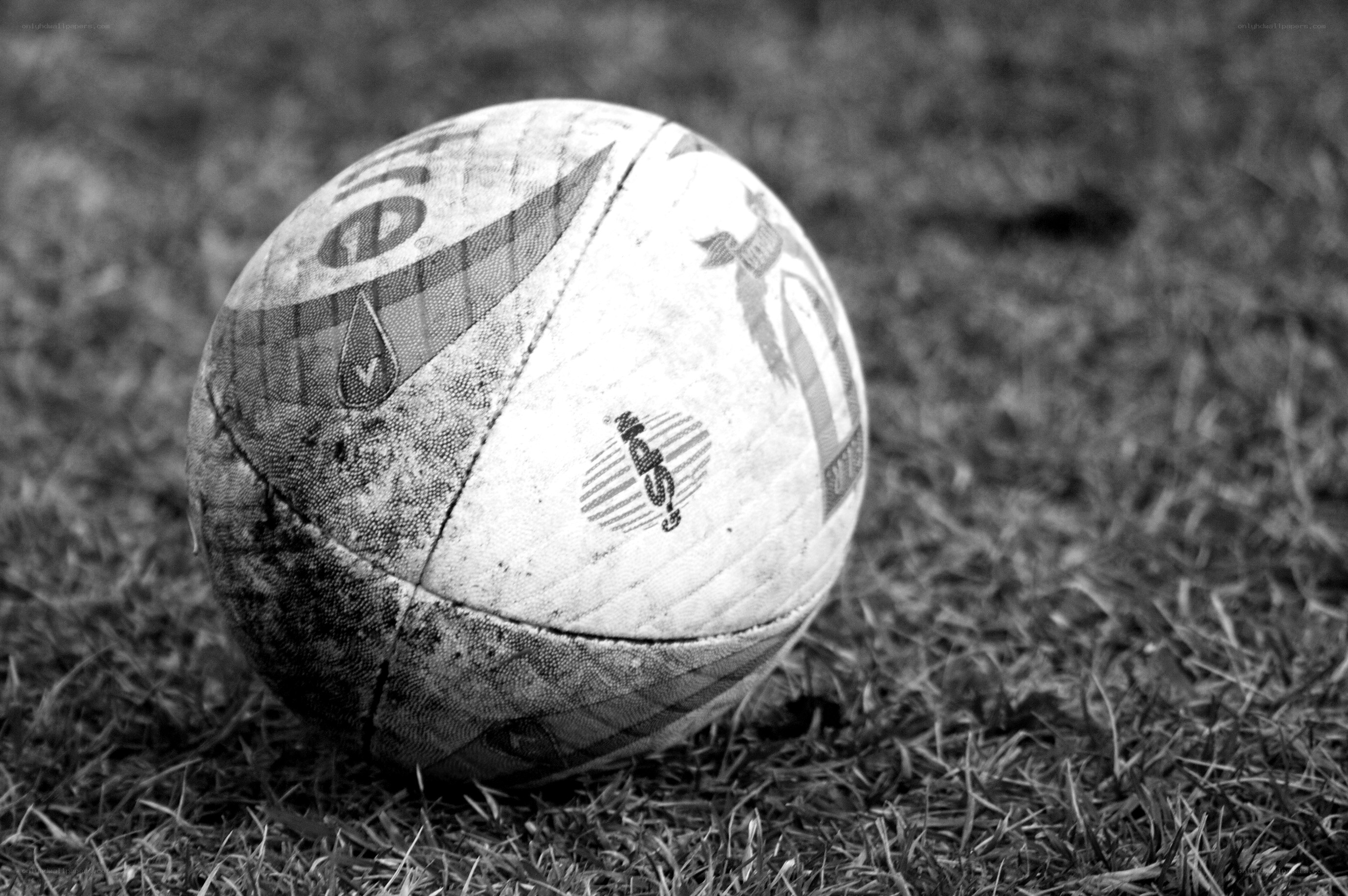 used rugby ball on grass
