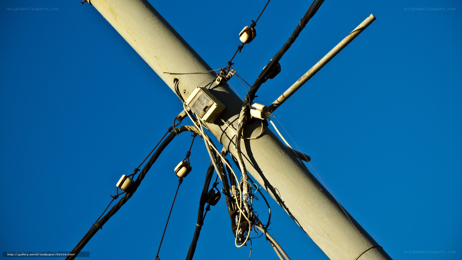 Utility pole against blue sky