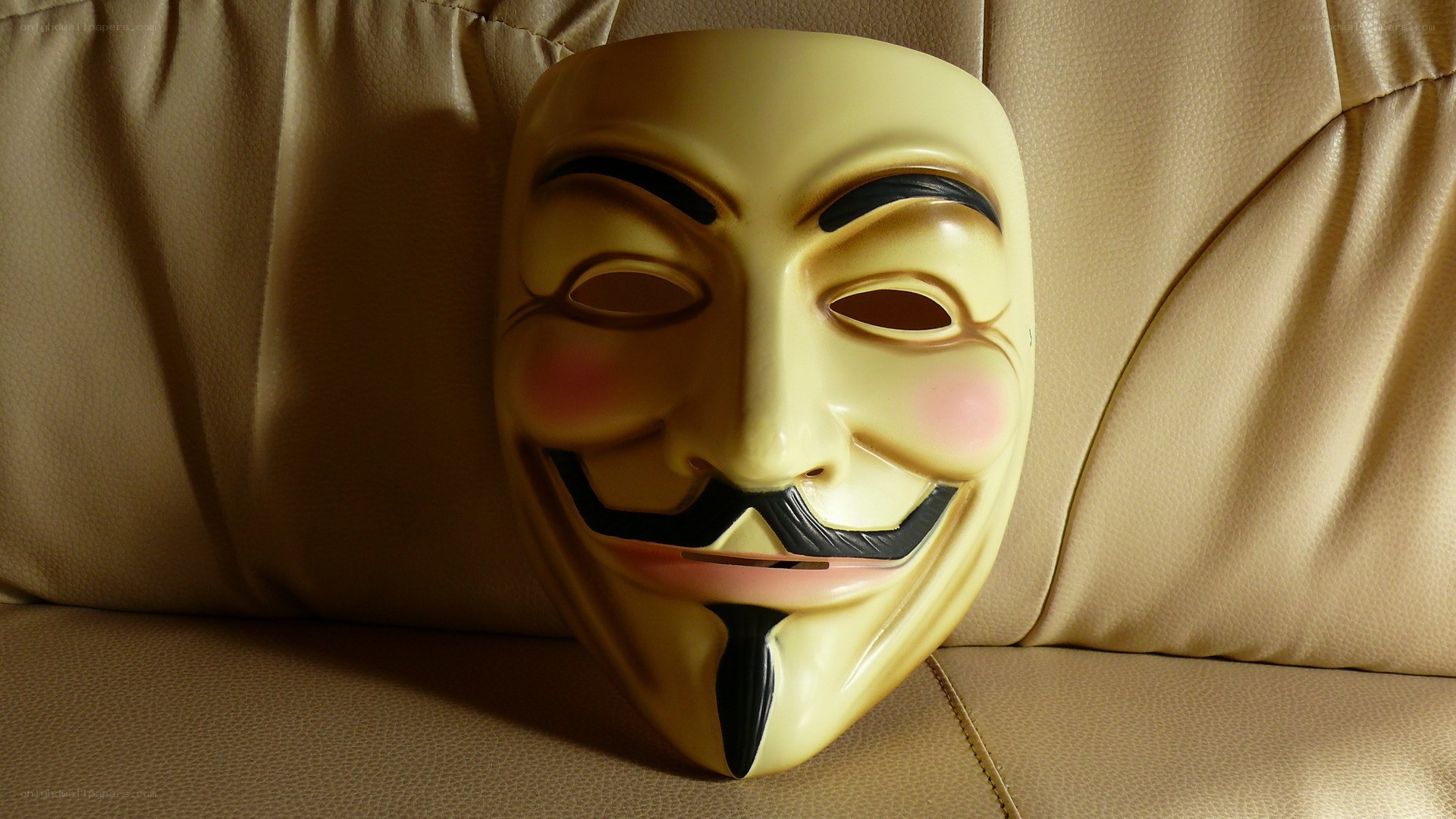 V for Vendetta mask on couch