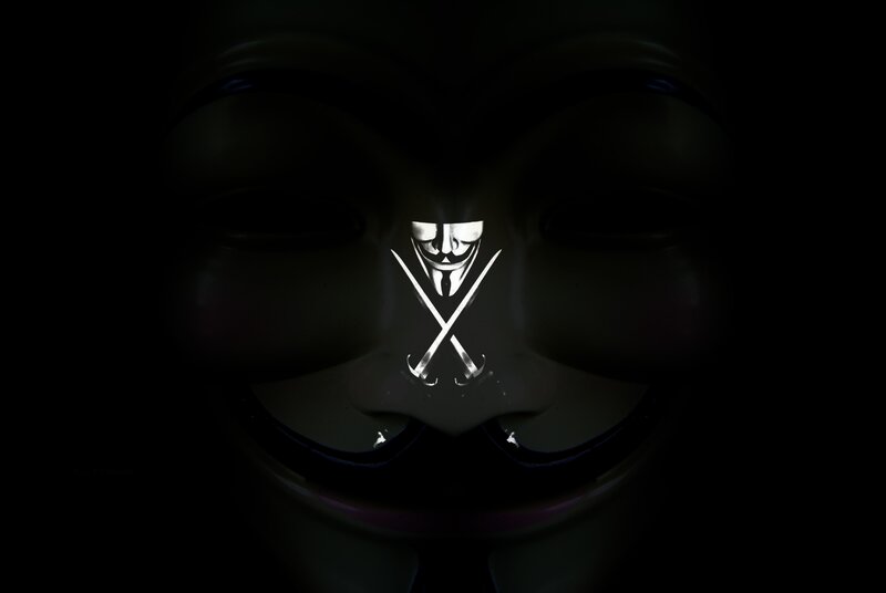 V for Vendetta mask with crossed swords