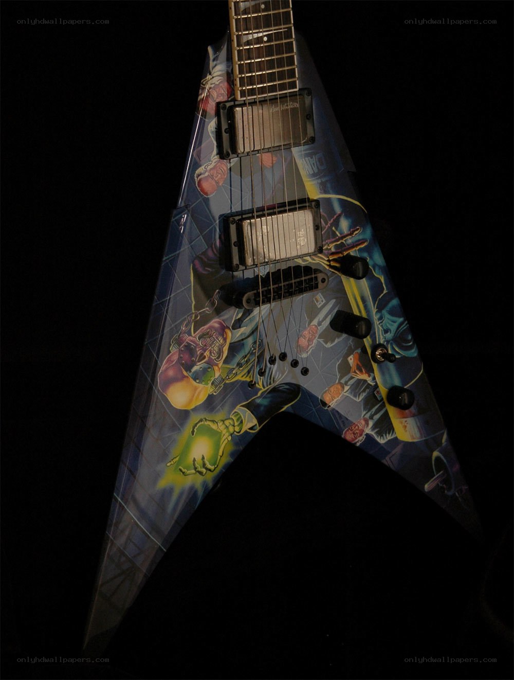 v-shaped electric guitar with artwork