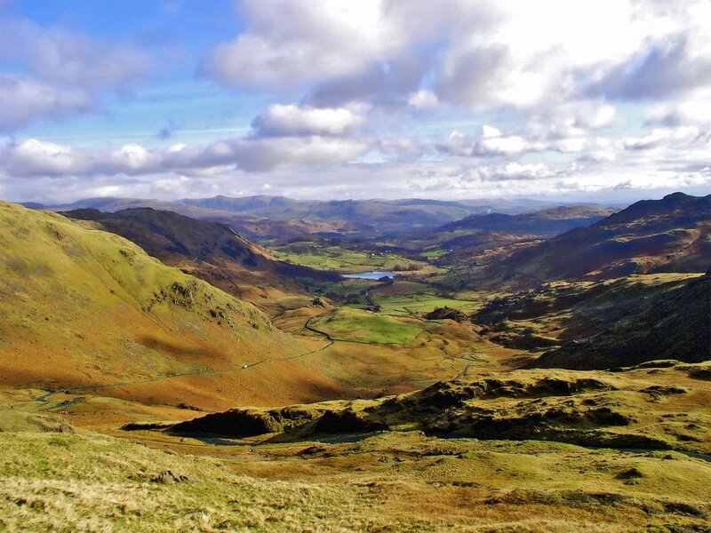 valley landscape with hills and lake