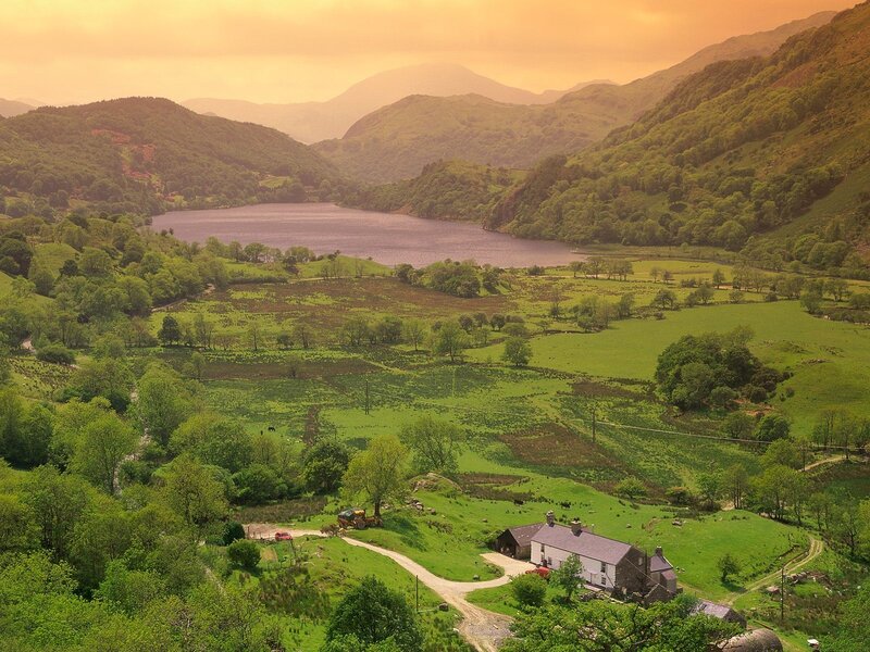 valley with lake and farmhouse