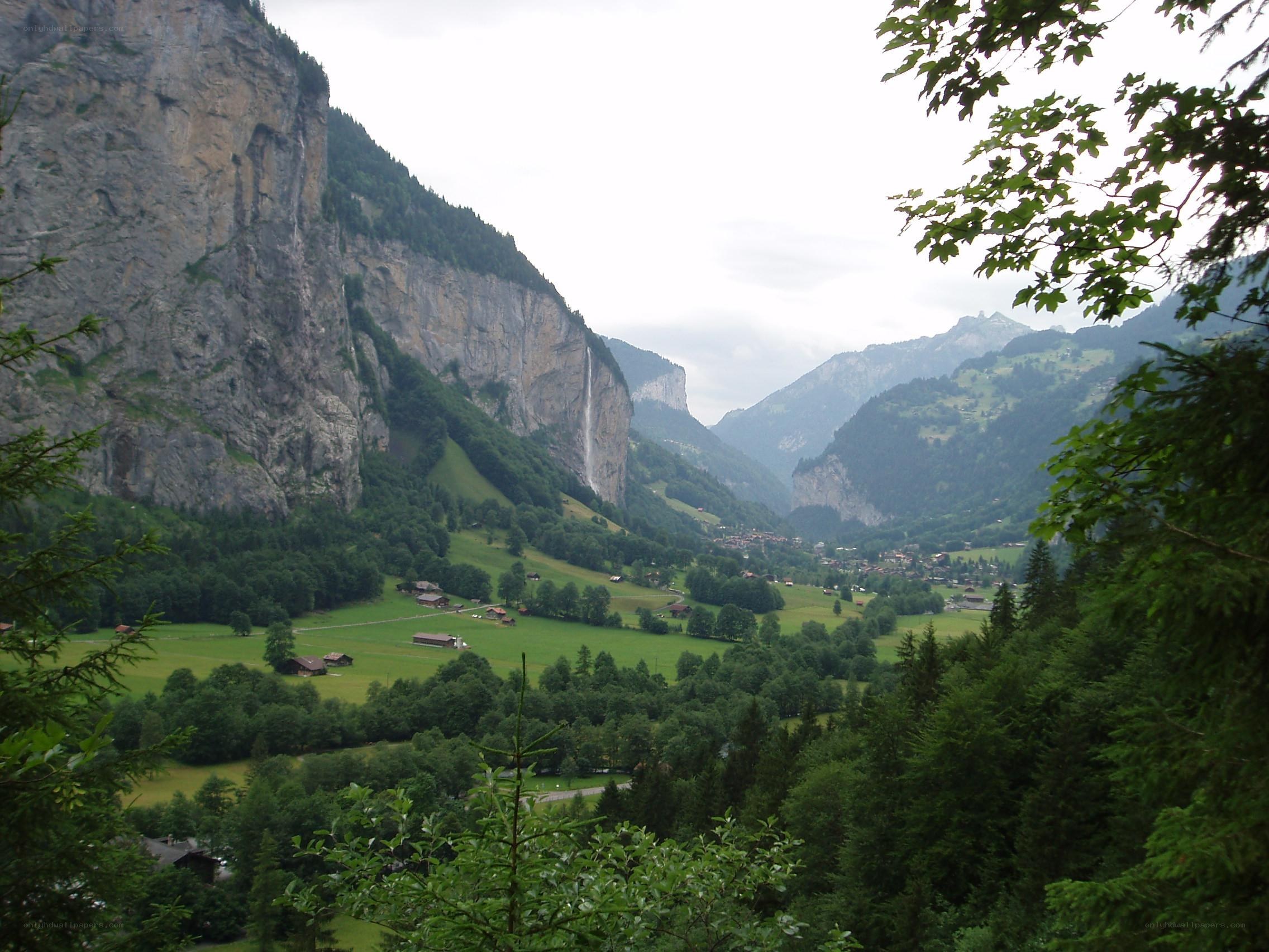 valley with waterfall and mountains