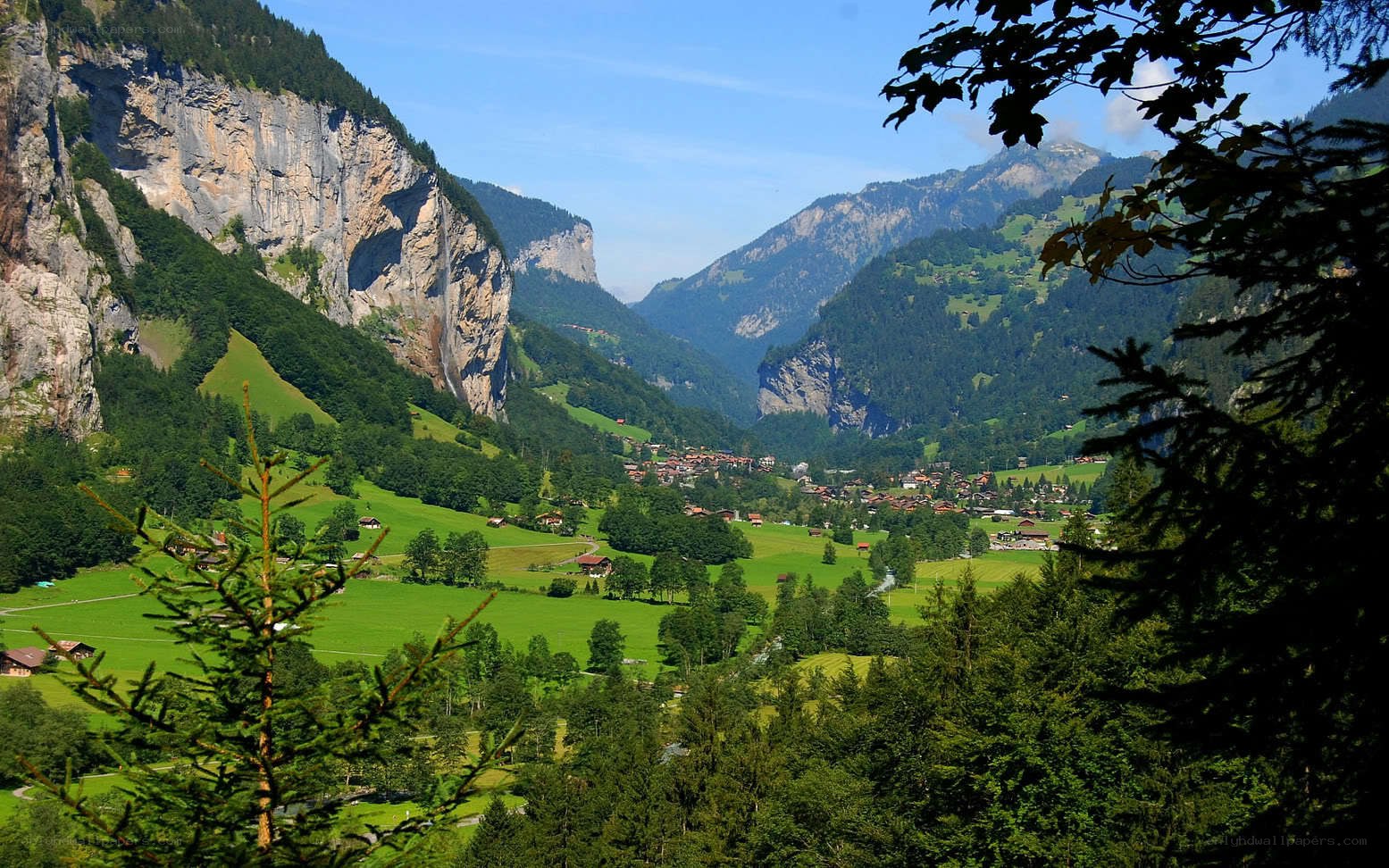 valley with waterfall and village