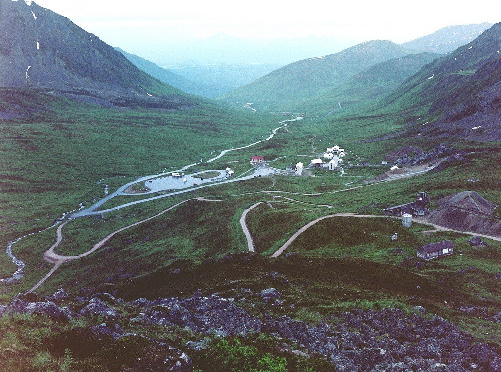 valley with winding roads and buildings