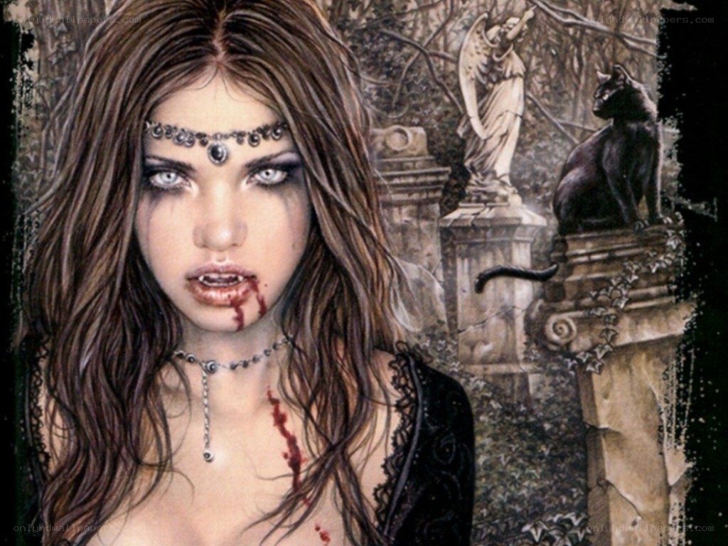 Vampire woman in a graveyard